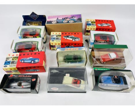 A collection of thirteen various branded boxed diecast toy cars to include: a boxed tin plate clockwork Bugatti T-35 Racer. E