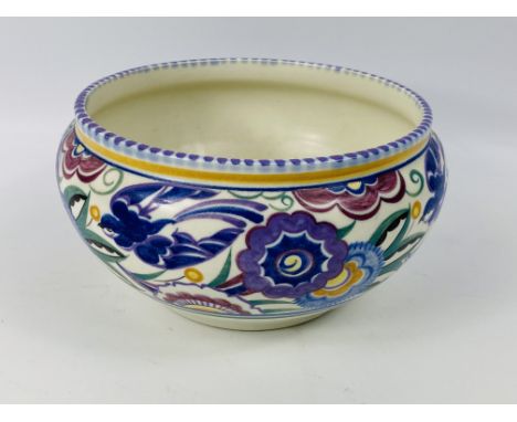 A large decorative Poole Pottery bowl, impressed mark to the base, 21.5cms wide x 12cms high. Estimate £20-30.