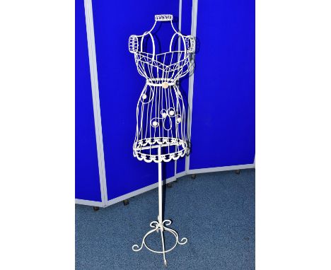 A CREAM PAINTED WIRE AND STAMPED METAL FEMALE MANNEQUIN, on a scrolled base, height 143cm (Condition Report: in fair conditio