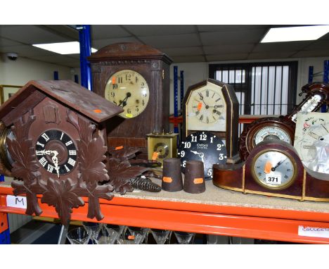 A GROUP OF CLOCKS AND BAROMETERS, to include a cuckoo clock with weights, two mantel clocks, a wooden cased bracket clock, a 
