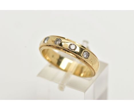 A 9CT GOLD DIAMOND BAND RING, a yellow gold band ring with step cut edges, approximate width 4.5mm, flush set with five round