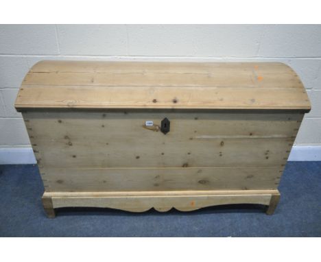 A 19TH CENTURY AND LATER PINE DOMED TOP TRUNK, tapered form, with iron handles, enclosing an internal section,  on a seperate