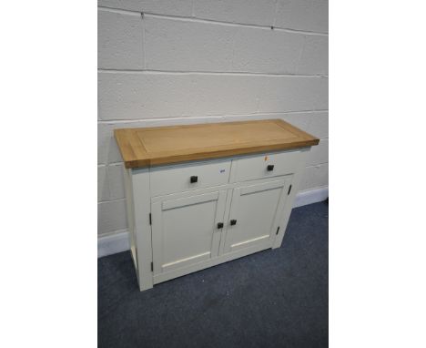 A LIGHT OAK AND PARTIALLY PAINTED SIDE TABLE, with two drawers, and double cupboard doors, width 100cm x depth 34cm x height 