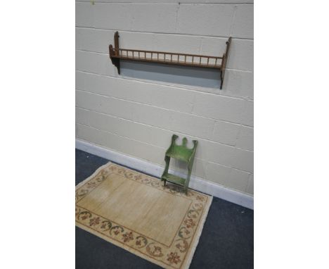 A MAHOGANY SPINDLE WALL SHELF, a painted wall shelf, and a G H Frith floral rug, 152cm x 91cm (3)