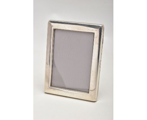 CONCORDE INTEREST - AN ELIZABETH II SILVER RECTANGULAR EASEL BACK PHOTOGRAPH FRAME, engraved 'CONCORDE' along the lower edge,
