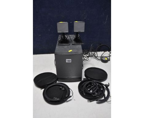 A BOSE COMPANION 3 SERIES MULTIMEDIA SPEAKER (PAT pass and powers up) along with two pairs of Bose sport earphones