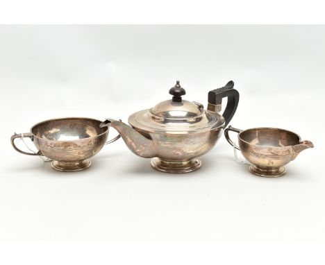 A GEORGE V SILVER THREE PIECE BACHELOR'S TEA SET OF CIRCULAR FORM, with shallow concentric horizontal bands below the rim, ma