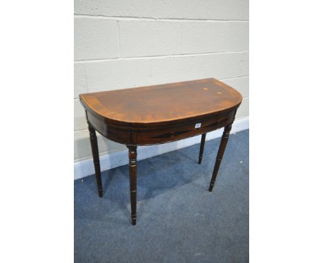 A GEORGIAN MAHOGANY AND ROSEWOOD CROSSBANDED CARD TABLE, with a double gate legs, the fold over top is enclosing a green baiz