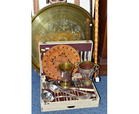 A GROUP OF METALWARES, comprising two walking sticks, a large circular brass serving tray, framed print, two ornate brass and