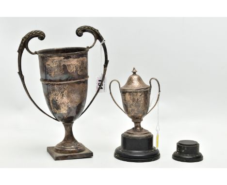 TWO 20TH CENTURY SILVER TWIN HANDLED TROPHY CUPS, the larger example on a square base, marks partially rubbed, height 23.5cm 