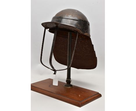 A REPRODUCTION CIVIL WAR LOBSTER TAIL HELMET, with stand (formerly from a set of balance scales) (2) (Condition Report: the h