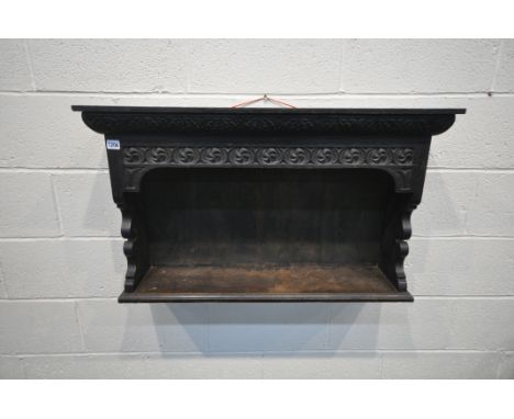 A CARVED OAK WALL SHELF, width 91cm x depth 23cm x height 54cm (condition:-alterations)