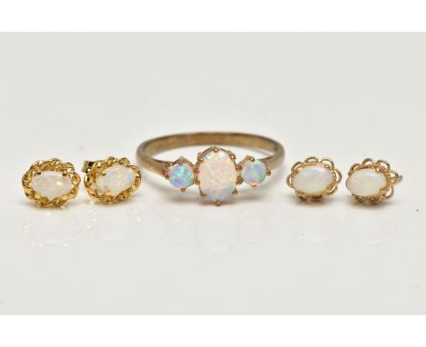 TWO PAIRS OF OPAL EARRINGS AND AN OPAL RING, two pairs of oval cut opal cabochons, each in a yellow metal mounts to the post 