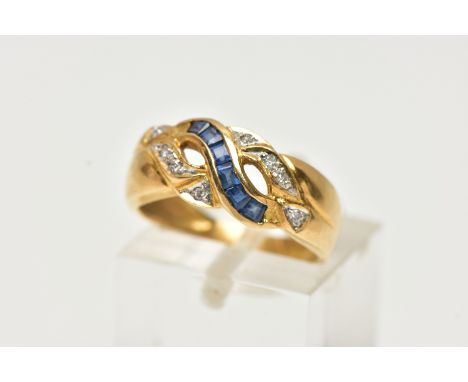 A YELLOW METAL SAPPHIRE AND DIAMOND RING, designed with a row of square cut blue sapphires, channel set asymmetrically to the