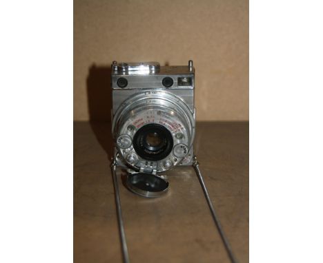 A Le COUTRE COMPASS MINIATURE CAMERA with an Anastigmat 35mm f3.5lens Serial No 3028
