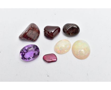 A SMALL BAG OF ASSORTED LOOSE GEMSTONES, to include two white opal cabochons, both showing flashes all the colours of the spe