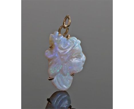 18 carat gold carved opal pendant, carved as a profile of  lady, 21mm high