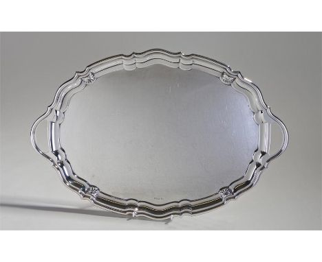 Elizabeth II silver tray, Sheffield 1960, maker Walker and Hall, the undualating edge with shell caps, arched handles, 53cm x