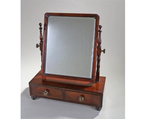 Victorian mahogany toilet mirror, the rectangular mirror plate held with two supports, two drawers to the base, raised on bun