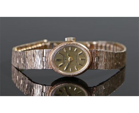 Rotary 9 carat gold ladies wristwatch, the oval signed dial with baton hours, bark effect 9 carat gold strap, case 15mm diame