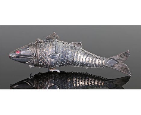 Continental white metal articulated fish snuff box, the hinged head with red eyes, articulated body, 10.5cm long
