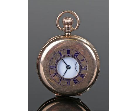 9 carat gold half hunter pocket watch, the case with a blue enamel dial opening to reveal a white enamel dial with Roman hour