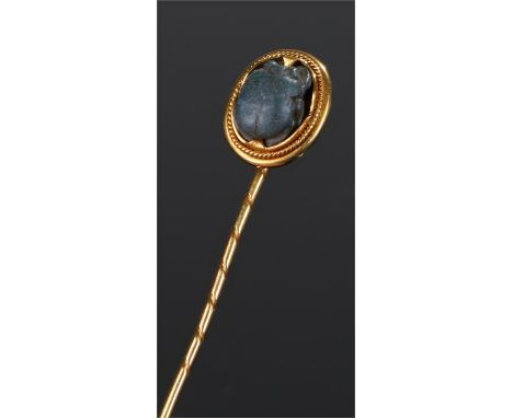 Ancient Egyptian scarab beetle set in a stick pin, turquise glazed, yellow metal mount and pin, 63mm long cased
