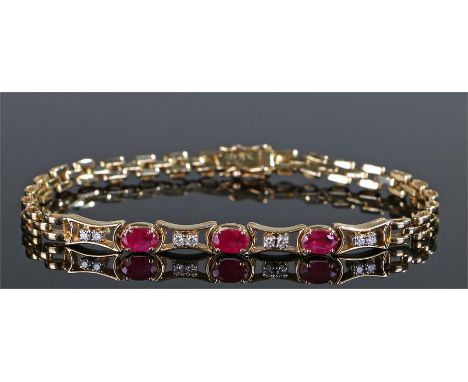 Yellow metal ruby and diamond bracelet, set with three rubies and eight diamonds, 13 grams