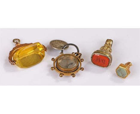 Three seals, to include a yellow metal engraved example, a swivel 9 carat gold seal, a gilt metal seal, together with a compa