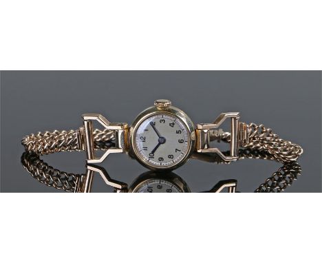 9 carat gold ladies wristwatch, the silvered circular dial with Arabic hours, manual wound movement, 9 carat gold bracelet, c