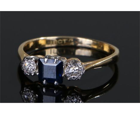 18 carat gold sapphire and diamond ring, the central sapphire flanked by diamonds, ring size K