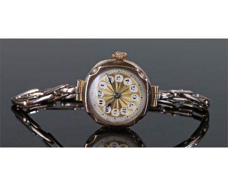 Ladies 9 carat gold wristwatch, the gilt dial with Arabic hours, 9 carat gold strap, manual wound, case 25mm diameter