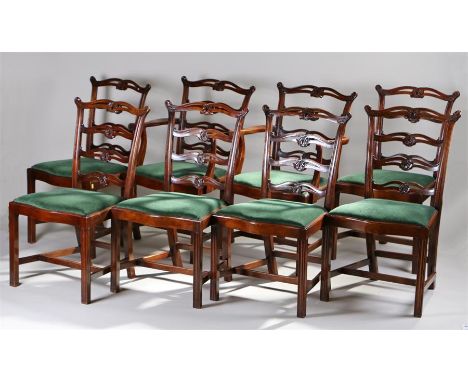 Set of eight George III style mahogany dining chairs, with arched and looped ladder backs, drop in seat and channel molded le