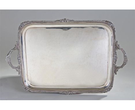 Edward VII large silver tray. Sheffield 1906, maker Atkin Bros, Harry Atkin. The gadrooned edge with shell caps, conforming s