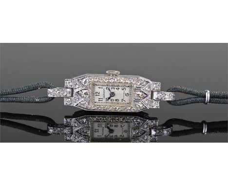 Benson platinum and diamond set ladies wristwatch, set with thirty nine diamonds to the shaped rectangular case, cream signed