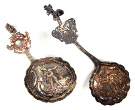 TWO CONTINENTAL SILVER DECORATIVE EMBOSSED CADDY AND SUGAR SPOONS, CIRCA LATE 19TH CENTURY, 1OZ