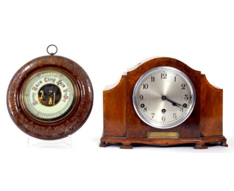 A VICTORIAN TURNED WALNUT ANEROID BAROMETER, 23CM DIAM, CIRCA 1900 AND A 1930'S WALNUT MANTLE CLOCK