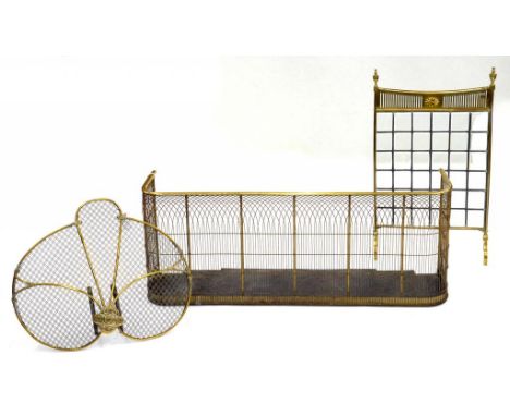 A VICTORIAN BRASS AND WIRE MESH NURSERY FENDER, 118CM W, AN EDWARDIAN BRASS AND BEVELLED GLASS FIRE SCREEN AND A VICTORIAN BR
