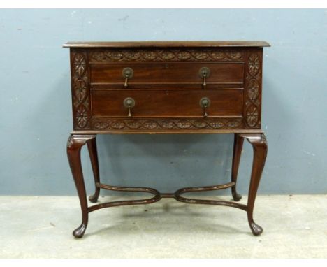 Early 20th century mahogany cased canteen of silver plated cutlery for 12, hinged top and two drawers on cabriole legs united