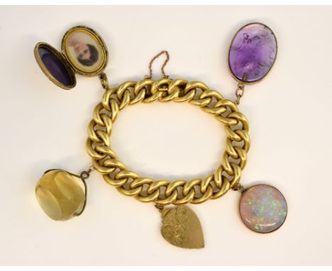 Victorian gold curb link chain bracelet, with a number of pendants, cabochon opal, gold heart locket, citrine fob and others,