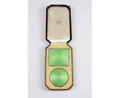 Silver and green enamel compact and cigarette case, hallmarked Birmingham 1933, by Adie Brothers Ltd, with fitted box .     B