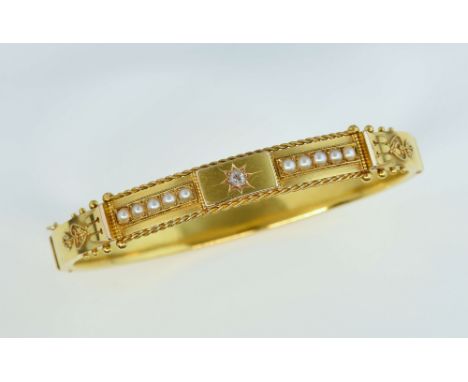 Victorian bangle, centrally set old cut diamond with 2mm pearls set either side, mounted yellow gold stamped 15ct, with hidde