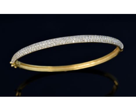 Gold hinged bangle pave set with small  diamonds, total diamond weight, 2.10 carats, boxed  .      good condition apparently 