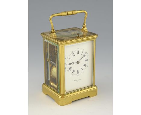Brass repeating carriage clock the dial inscribed Edward and Sons Paris. 18cm with earlier carrying case.     Carrying case h