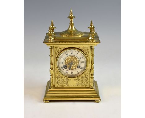 French brass mantel clock, the silvered dial with Roman numerals and twin train movement striking on a gong, the case with sc