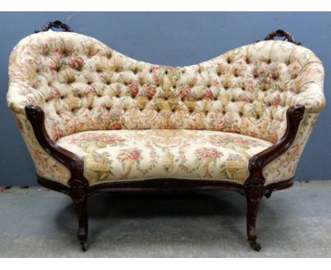 A mahogany framed upholstered button back sofa..     Carved top rails both have been repaired, back leg has been off and repa