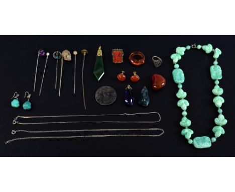 Group of jewellery in a crocodile skin jewellery  case, nephrite jade pendant in gold mount,  a lava stick pin carved as a sk