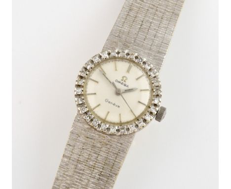 Omega Ladies dress watch. set in a polished 18ct white gold oval case with diamond set bezel, faceted glass, dial set with Ba