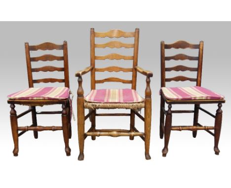 Set of nine ( 8+1) oak ladder back dining chairs rush seats on turned legs .     