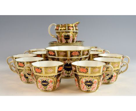 Crown Derby Imari pattern part tea service comprising cream jug, sugar bowl, eleven cups and eleven saucers, various date mar